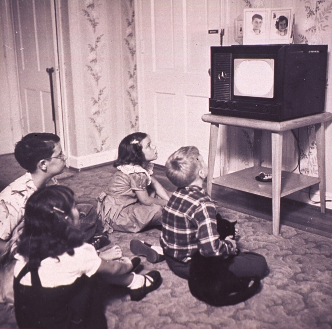 group watching tv